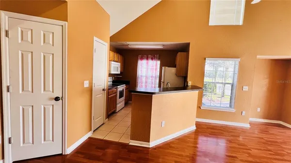 a view of room with window and ceiling fan