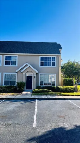 a view of a house with swimming pool and yard
