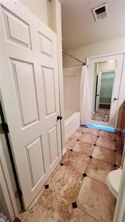 a view of a balcony with a green space