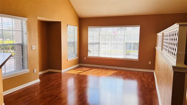 a view of an empty room with glass door