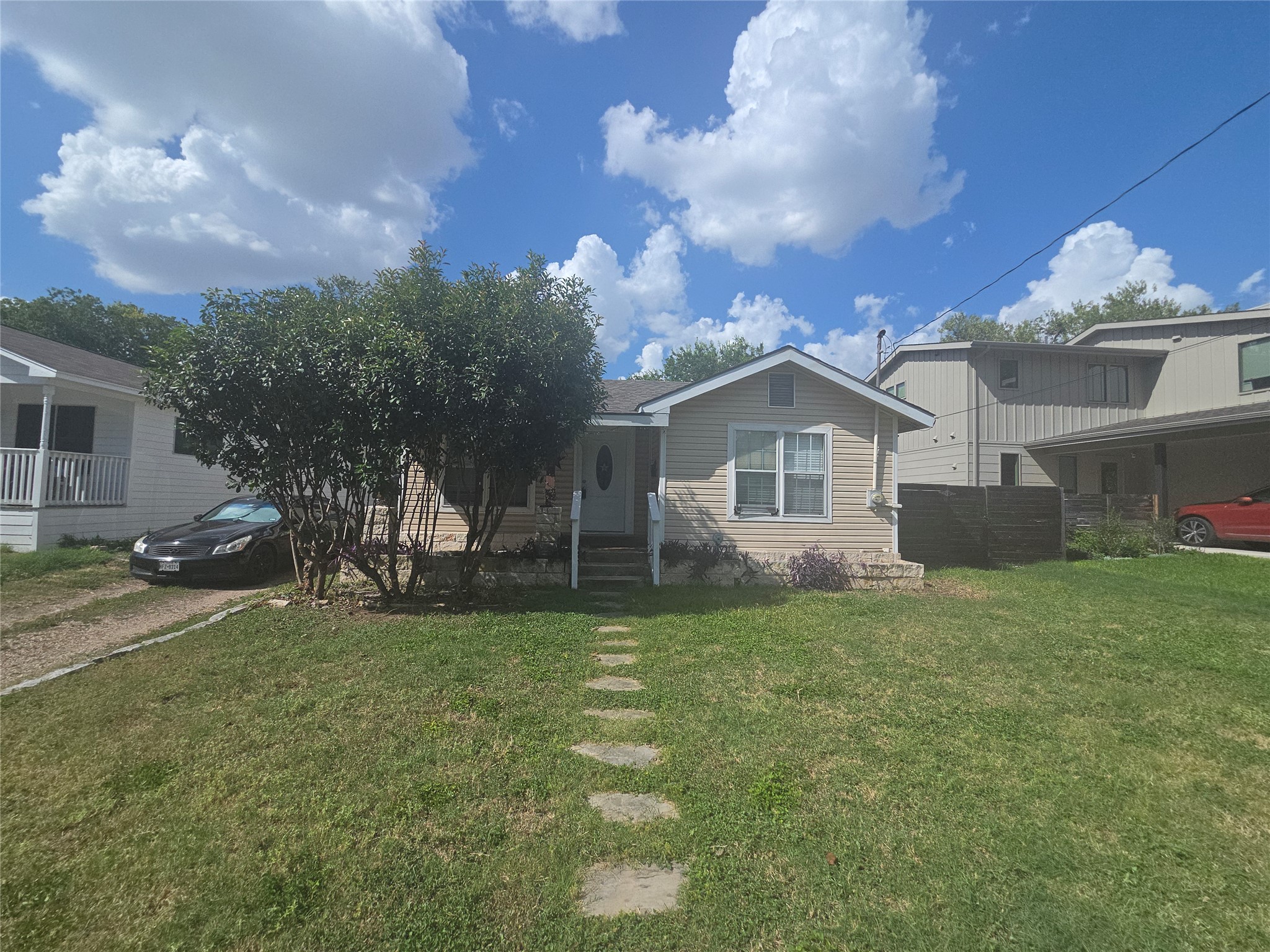 922 East 50th Street Austin, TX 78751 - Photo 35 of 35 A charming single-story home with a neat lawn and stepping stone pathway awaits.
