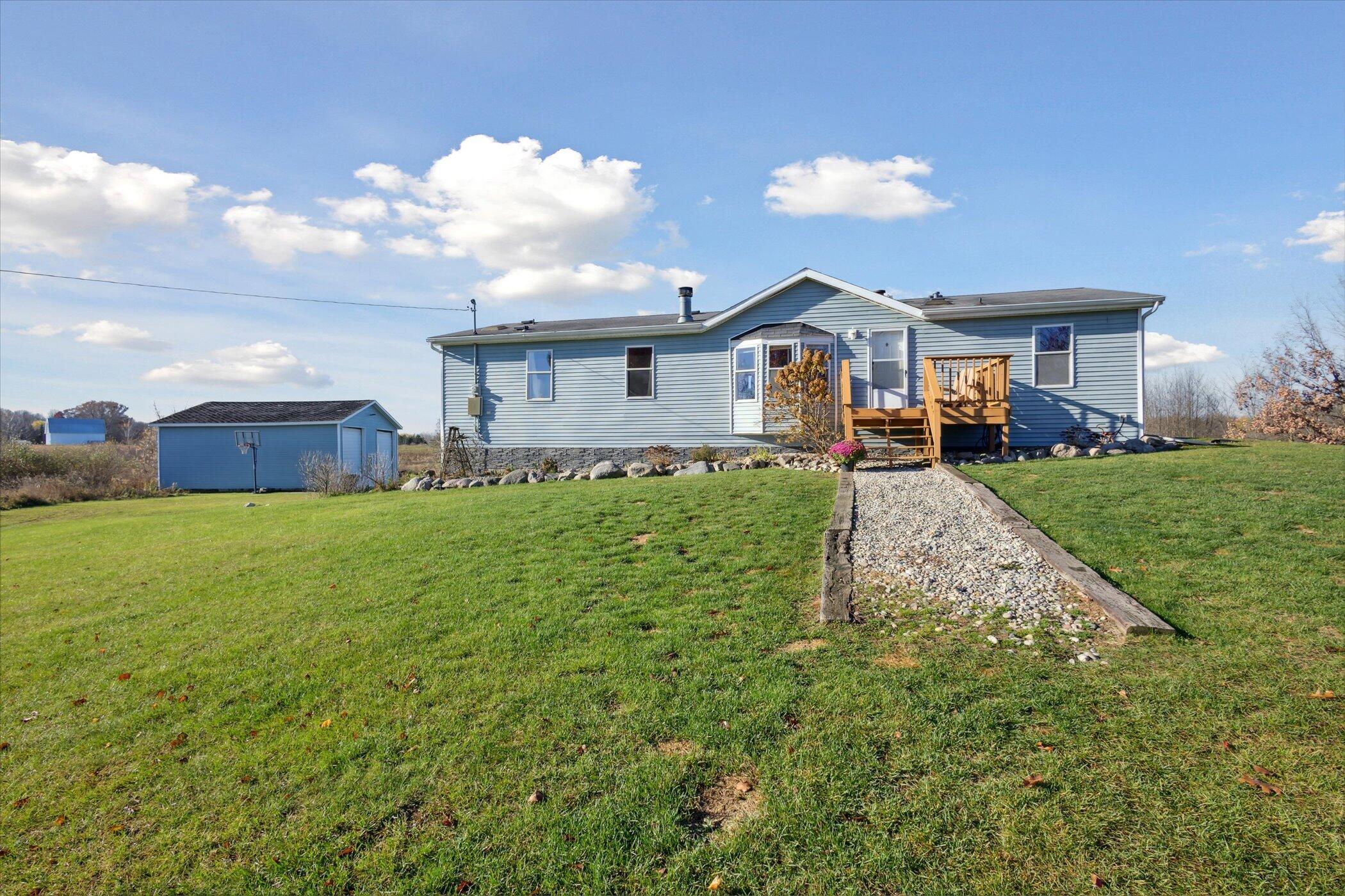 8231 Derby Road Six Lakes, MI 48886 - Photo 3 of 66 03-8231-Derby-Rd-Six-Lakes-MI-48886-Wind