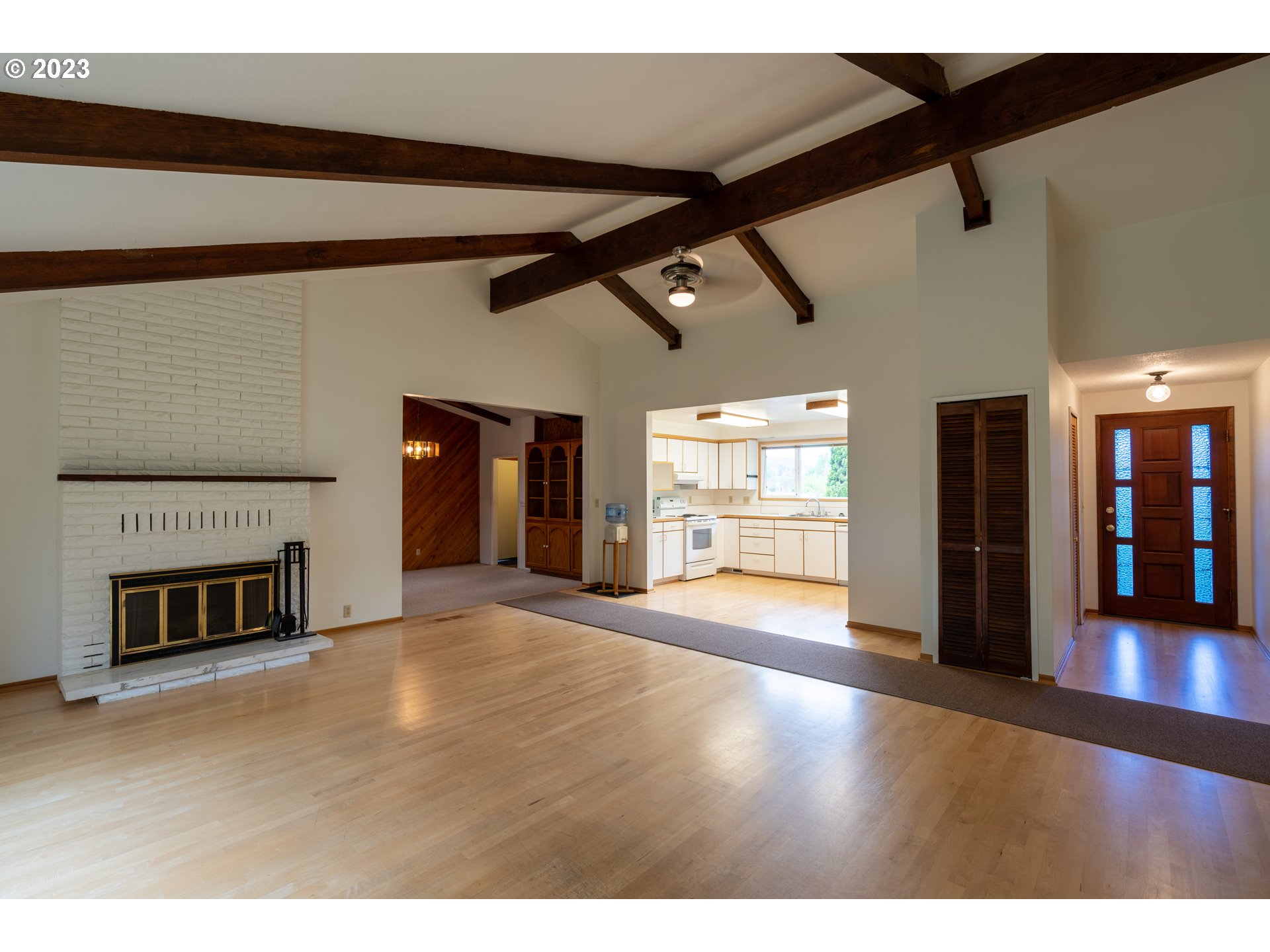 91237 Donna Road Springfield, OR 97478 - Photo 25 of 47 a view of empty room with wooden floor and fireplace