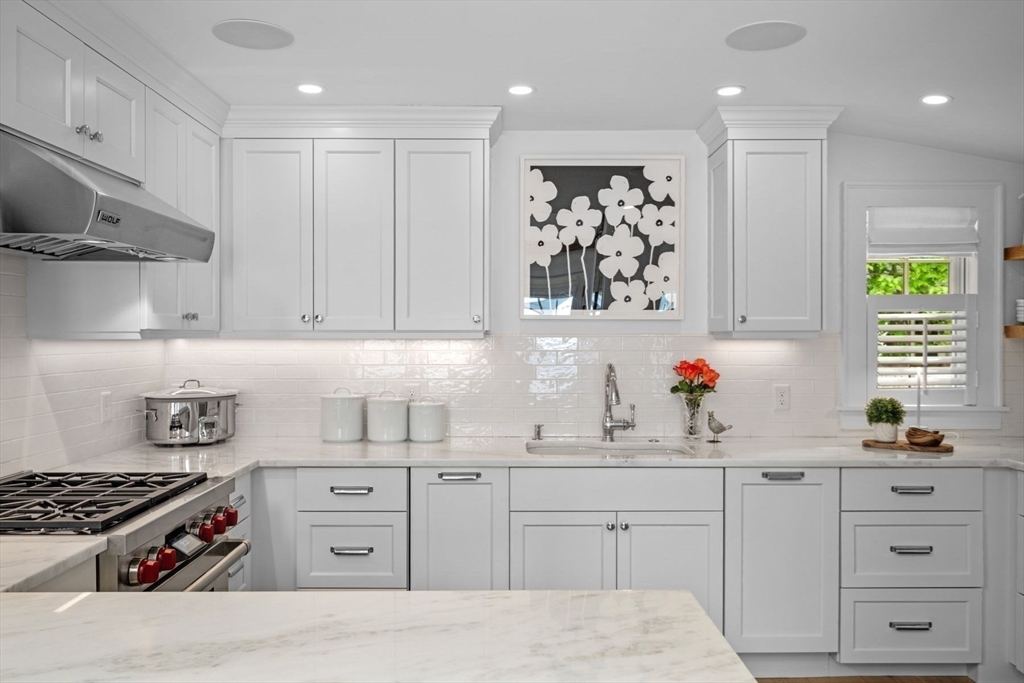 31 Franklin Street Marblehead, MA 01945 - Photo 17 of 35 a kitchen with white cabinets and appliances