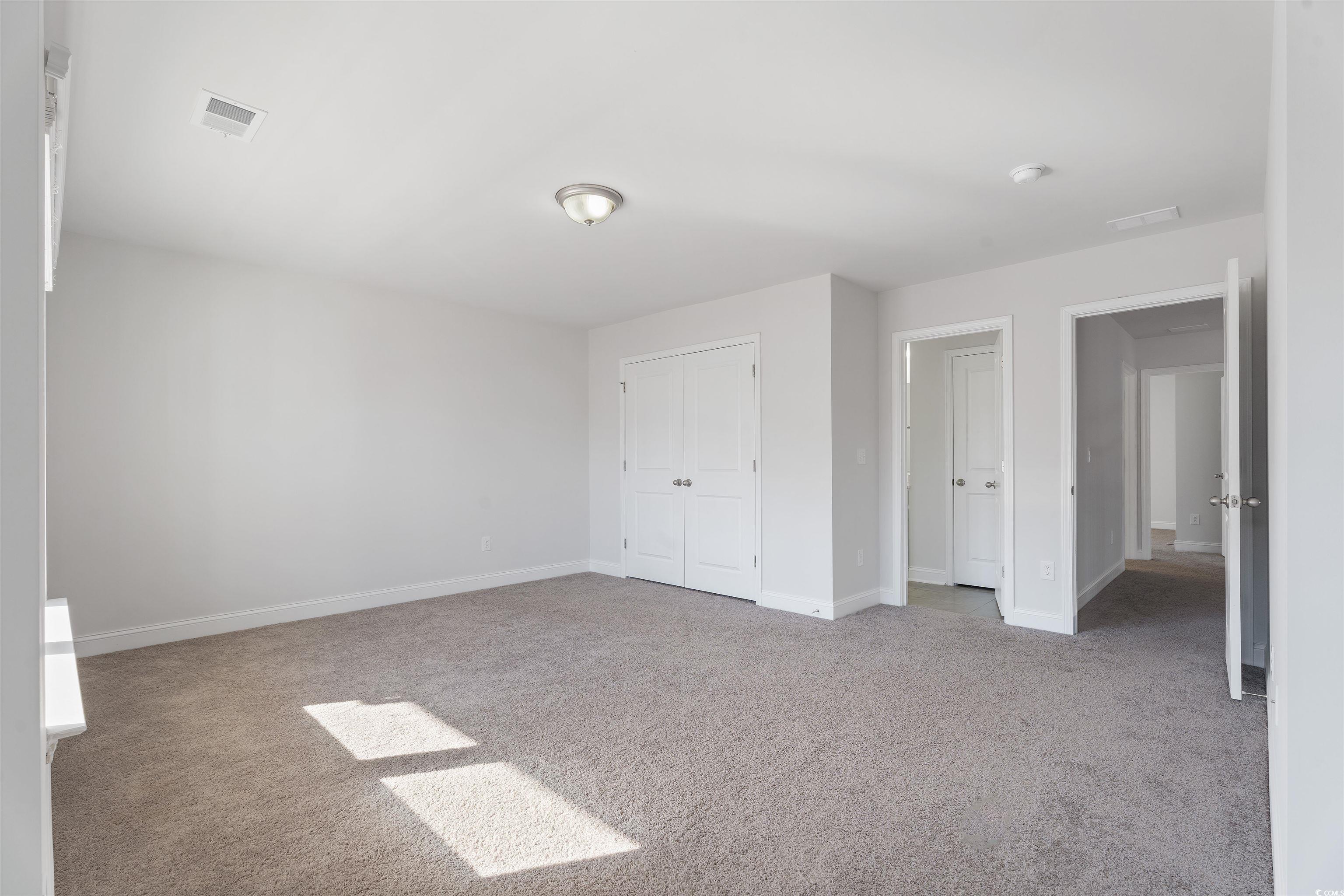 227 Walnut Grove Myrtle Beach, SC 29579 - Photo 19 of 28 Unfurnished bedroom with carpet flooring and a clo