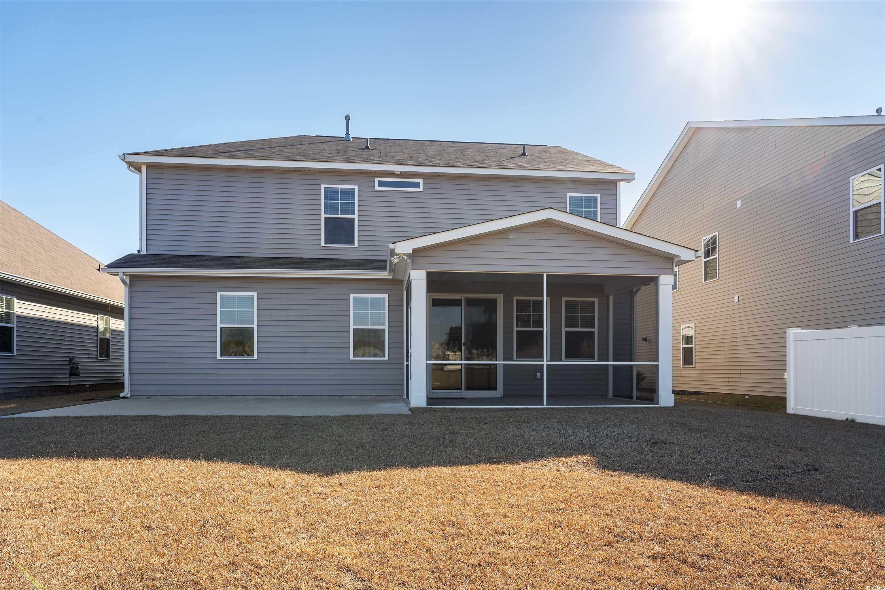 227 Walnut Grove Myrtle Beach, SC 29579 - Photo 24 of 28 Back of house featuring a patio, a sunroom, and a