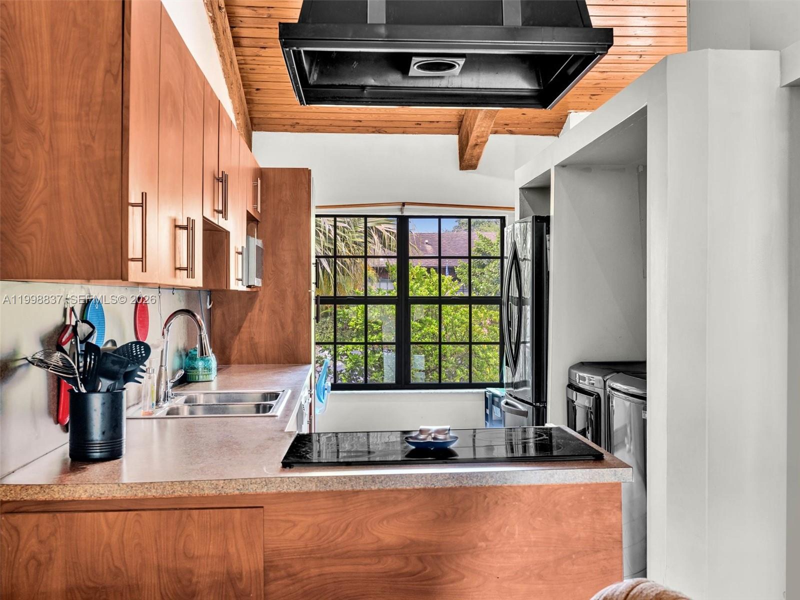 13406 Southwest 102nd Lane Miami, FL 33186 - Photo 13 of 47 a kitchen with a sink and a window