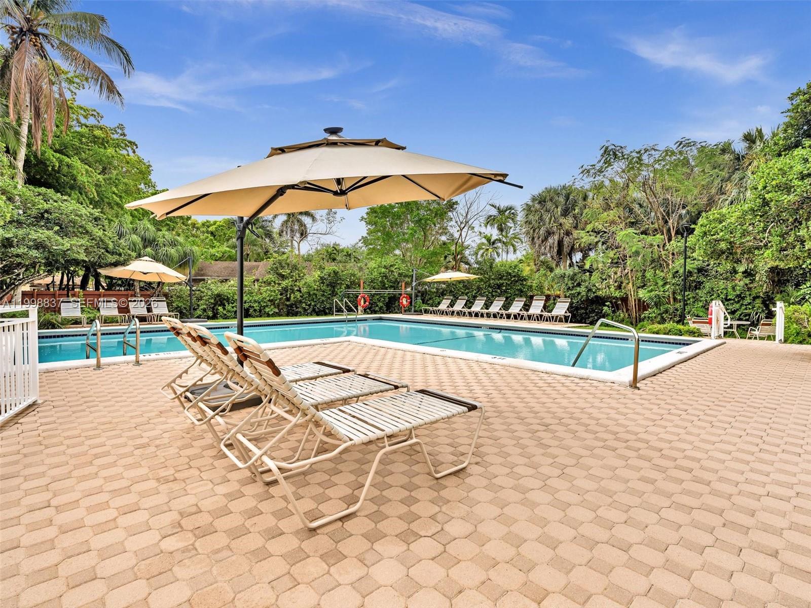 13406 Southwest 102nd Lane Miami, FL 33186 - Photo 38 of 47 a view of a tennis ground with a palm trees