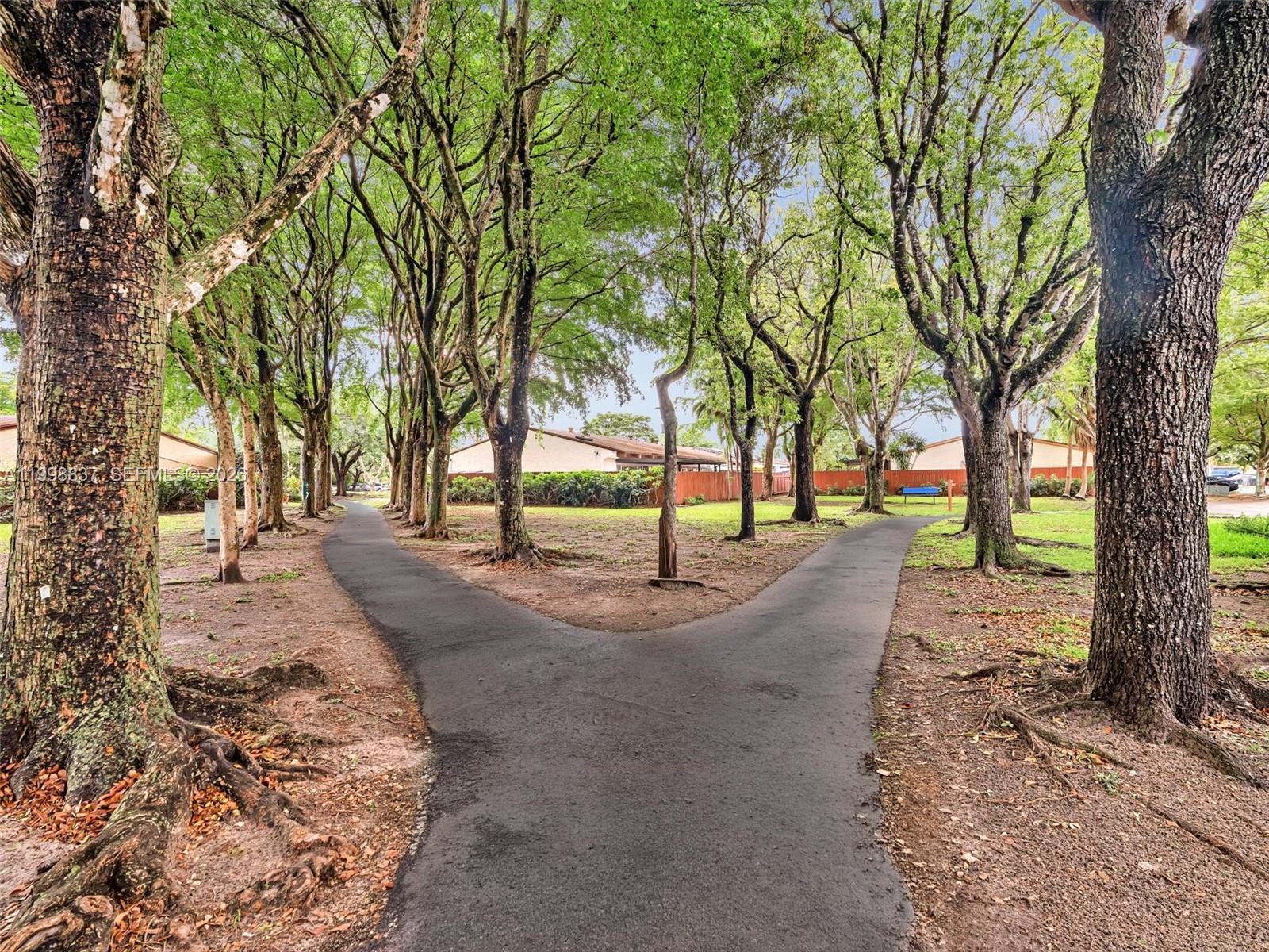 13406 Southwest 102nd Lane Miami, FL 33186 - Photo 42 of 47 a view of road with trees