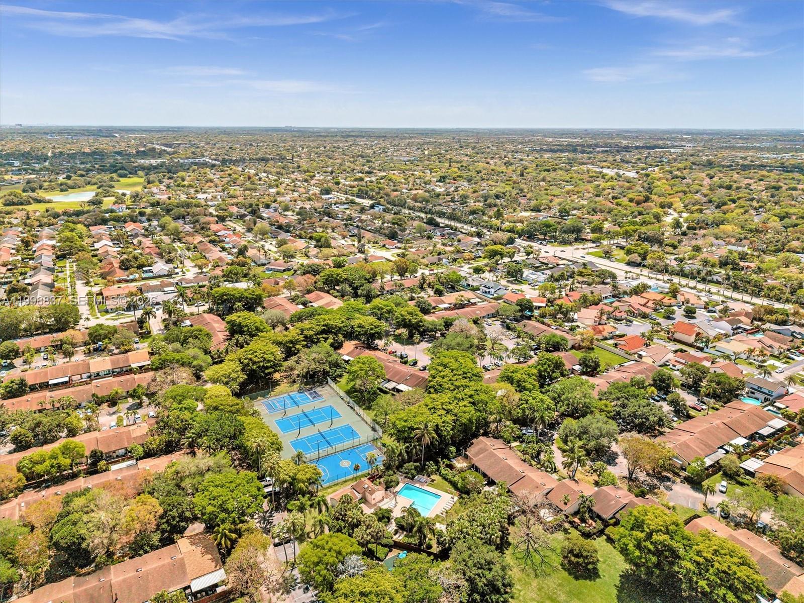 13406 Southwest 102nd Lane Miami, FL 33186 - Photo 44 of 47 an aerial view of residential building and lake