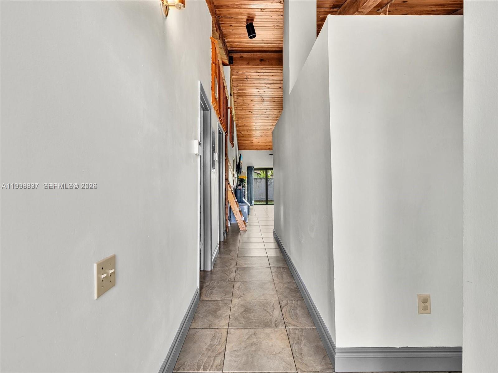 13406 Southwest 102nd Lane Miami, FL 33186 - Photo 7 of 47 a view of a hallway with a white door