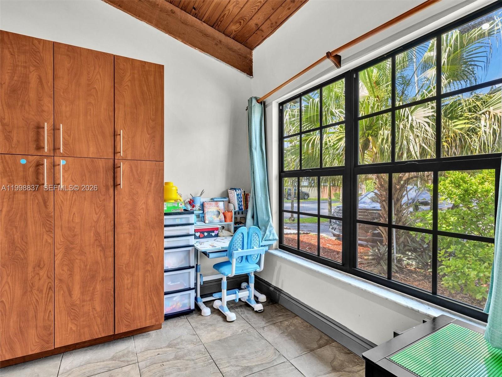 13406 Southwest 102nd Lane Miami, FL 33186 - Photo 9 of 47 a room with musical instruments