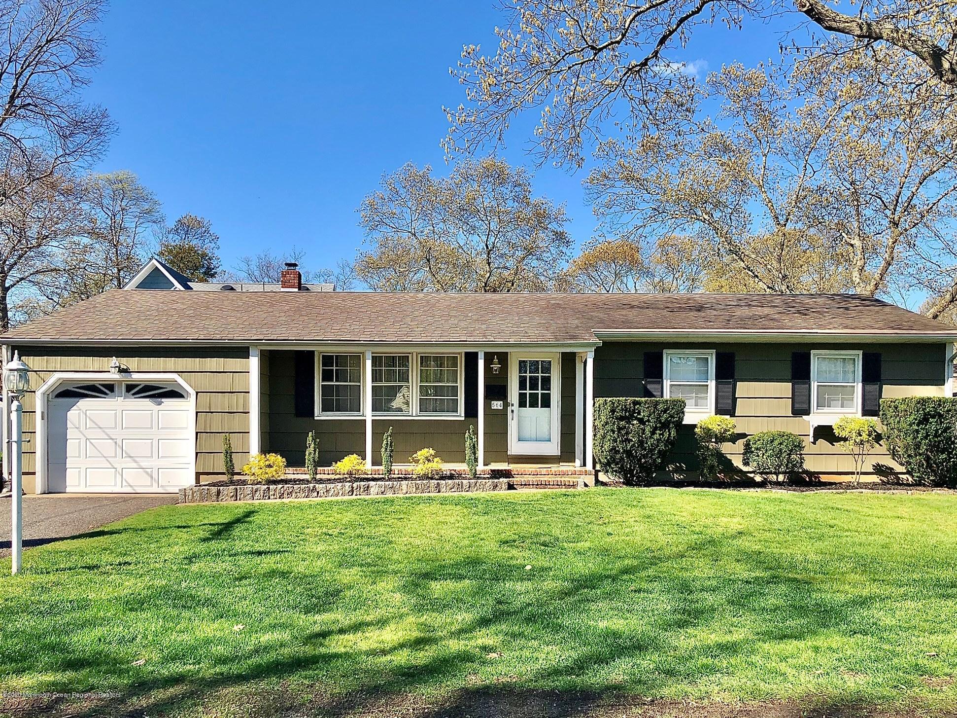 564 Nicholas Road Brick, NJ 08724 - Photo 1 of 22 front view of a house with a yard
