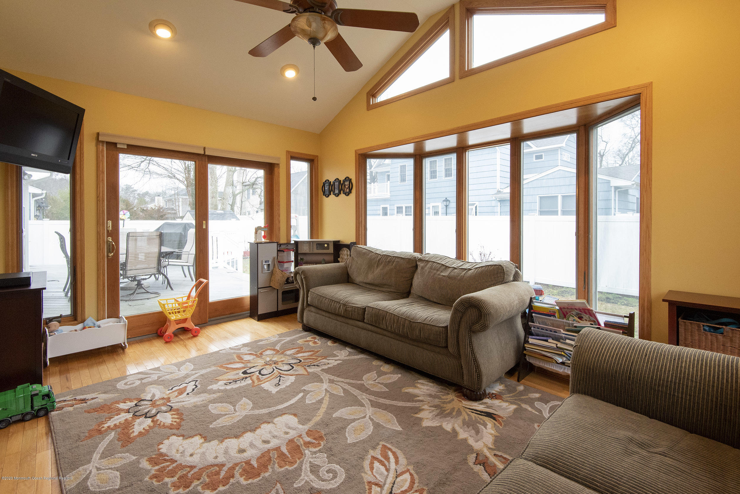 564 Nicholas Road Brick, NJ 08724 - Photo 13 of 22 a living room with furniture and floor to ceiling windows