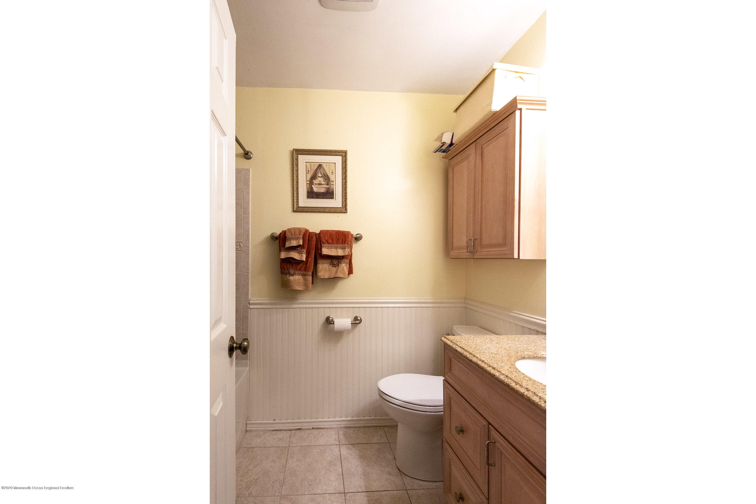 564 Nicholas Road Brick, NJ 08724 - Photo 14 of 22 a bathroom with a toilet a sink and mirror