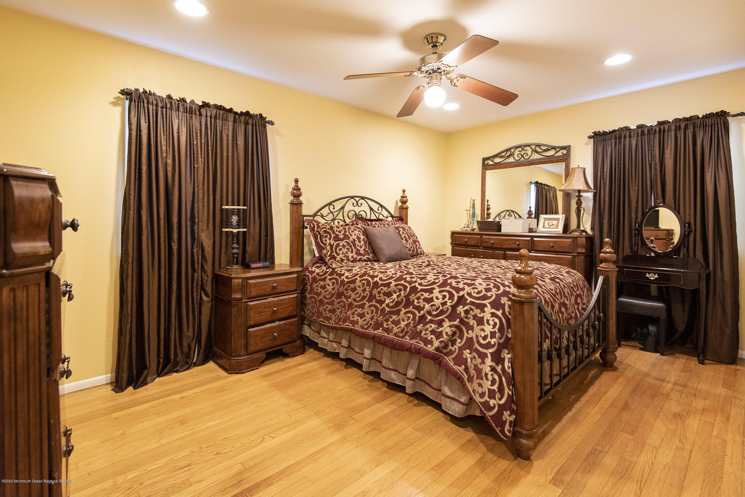 564 Nicholas Road Brick, NJ 08724 - Photo 15 of 22 a bedroom with a bed dresser and a walk in closet