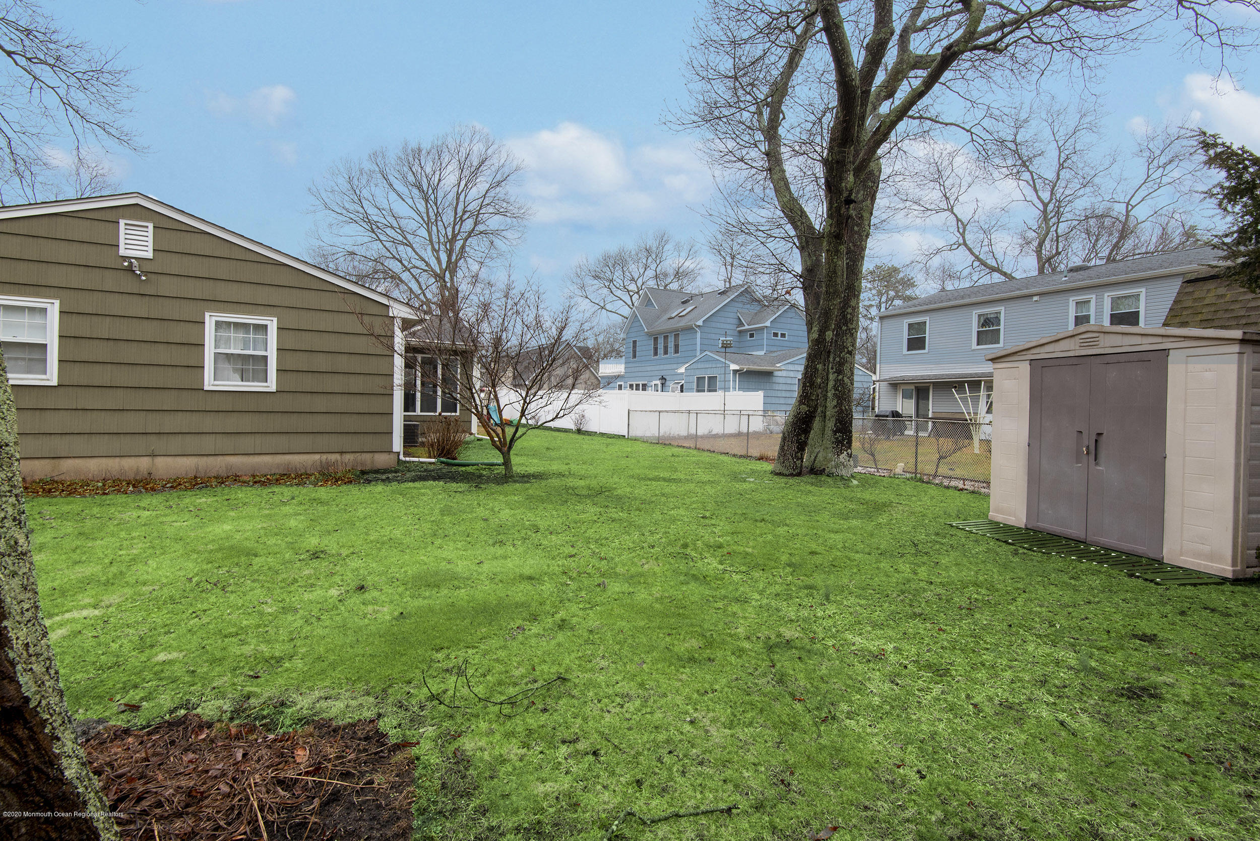 564 Nicholas Road Brick, NJ 08724 - Photo 22 of 22 a view of a backyard with a large tree