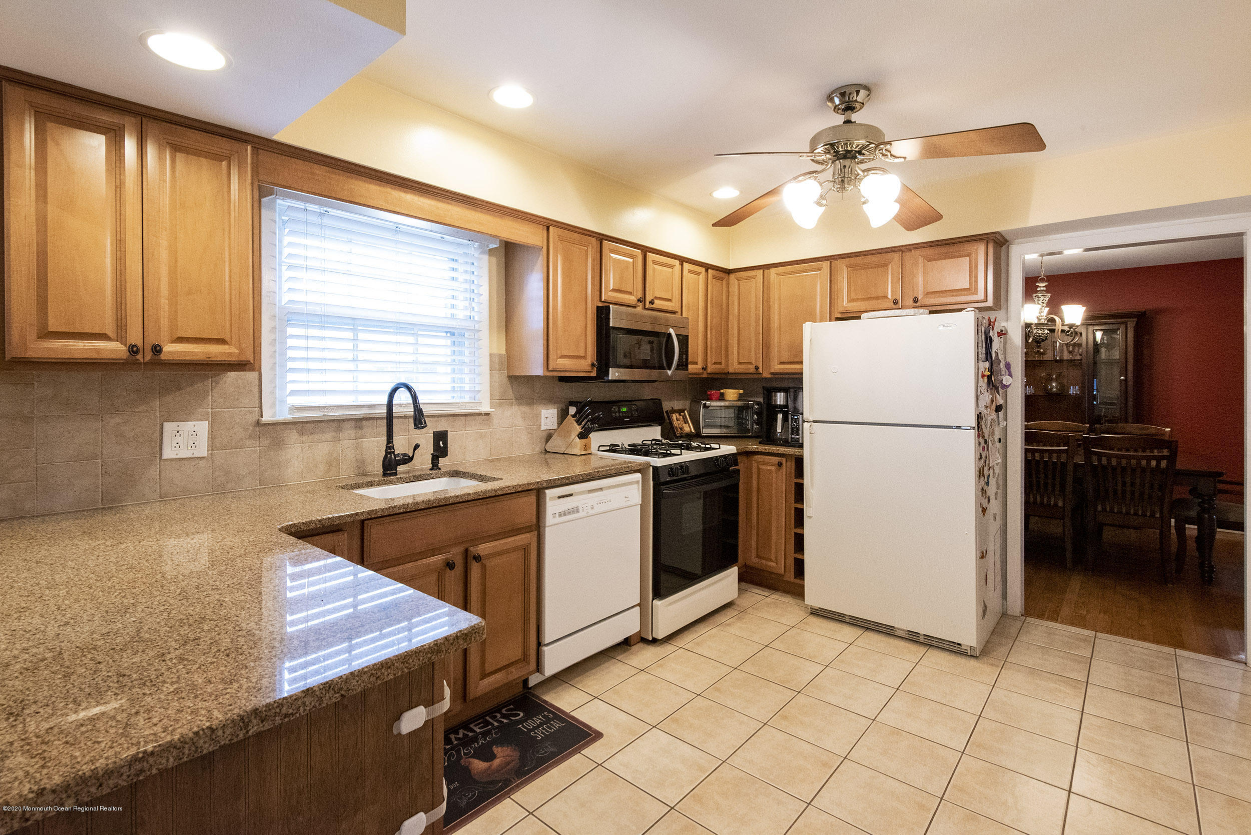 564 Nicholas Road Brick, NJ 08724 - Photo 9 of 22 a kitchen with a refrigerator a microwave and sink