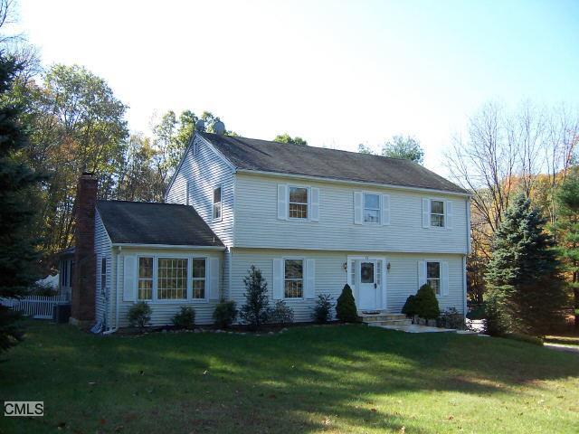 39 Topledge Road Redding, CT 06896 - Photo 1 of 1 a front view of a house with a garden