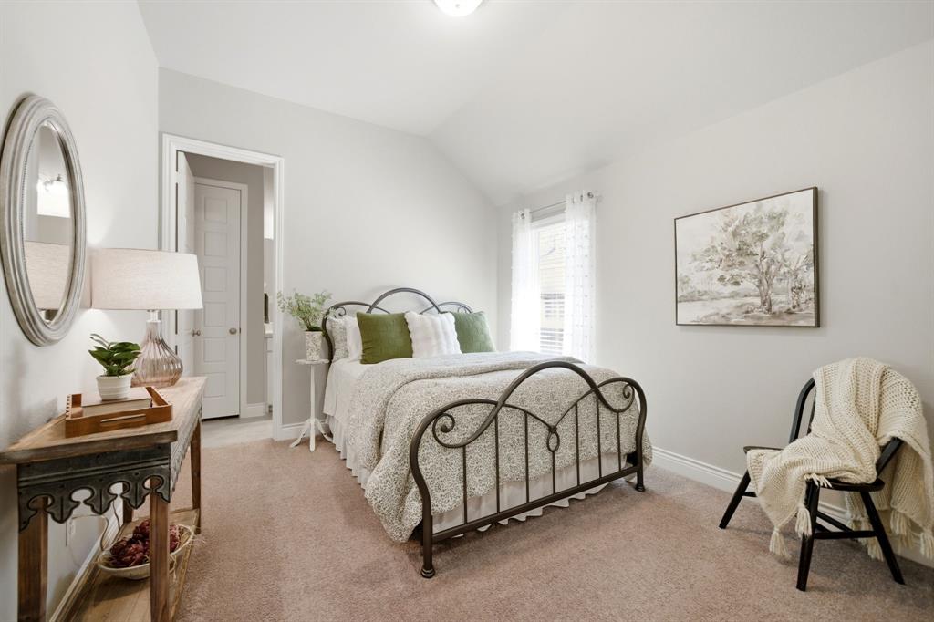 1121 Bantham Way Forney, TX 75126 - Photo 23 of 28 Bedroom with convenient private ensuite bath.