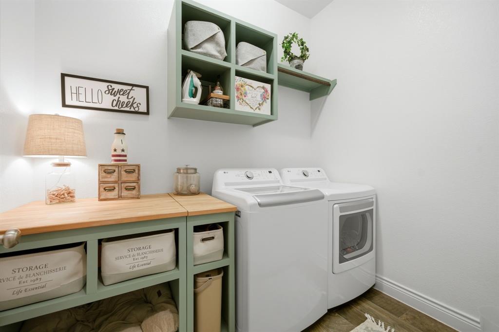 1121 Bantham Way Forney, TX 75126 - Photo 25 of 28 Spacious laundry room featuring custom cabinetry.