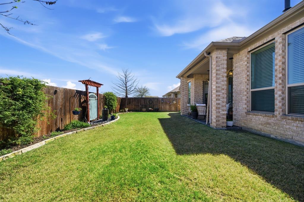 1121 Bantham Way Forney, TX 75126 - Photo 26 of 28 Sprinkler system conveniently provides low maintenance in both the front and back yard.