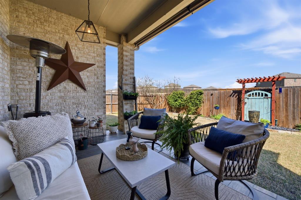 1121 Bantham Way Forney, TX 75126 - Photo 27 of 28 Beautifully tiled flooring under the covered patio. Enjoy morning coffee or relax in the evenings.