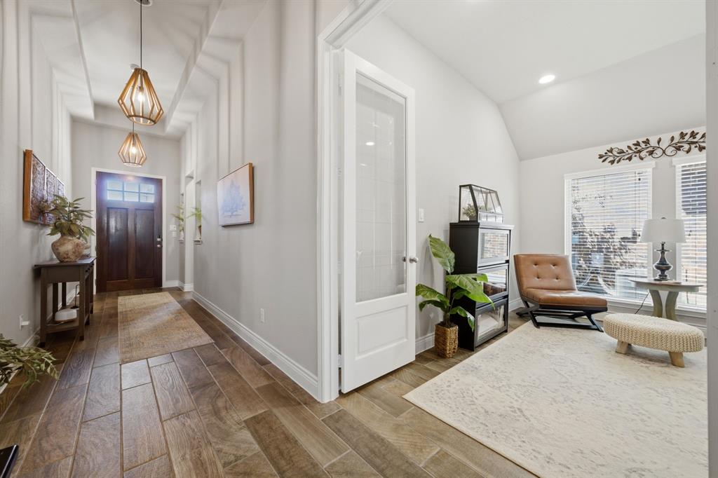 1121 Bantham Way Forney, TX 75126 - Photo 6 of 28 View toward the front entrance featuring updated light fixtures.