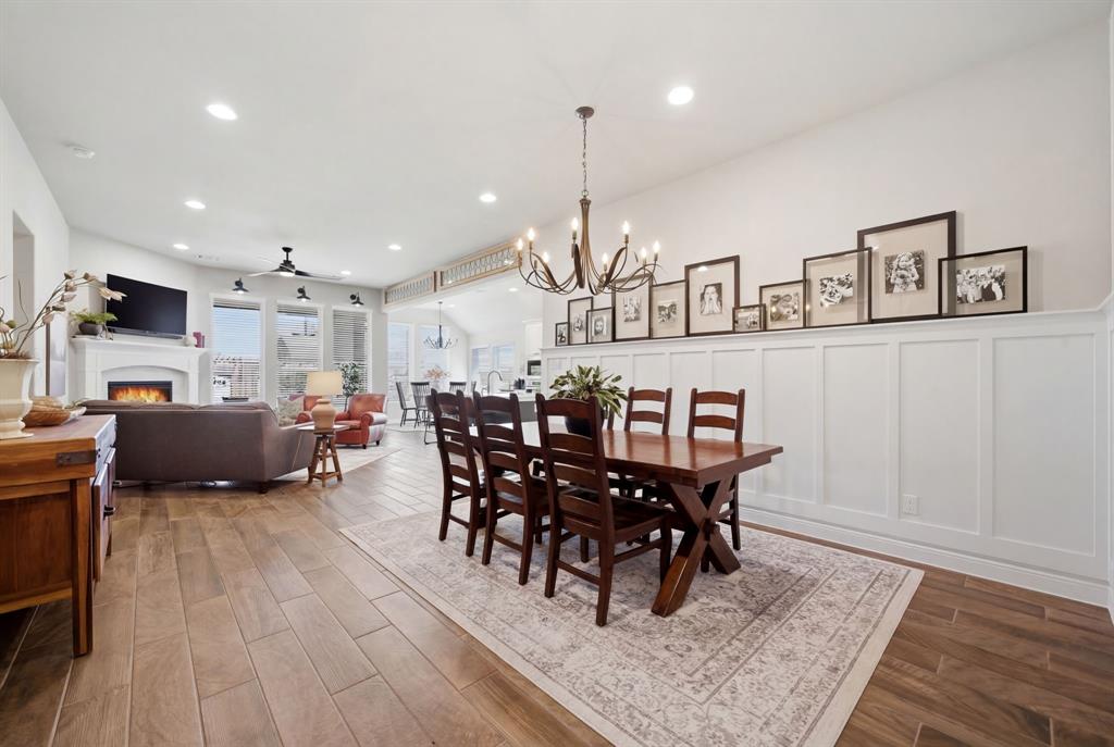 1121 Bantham Way Forney, TX 75126 - Photo 7 of 28 Dining area with wainscotting and updated chandelier.