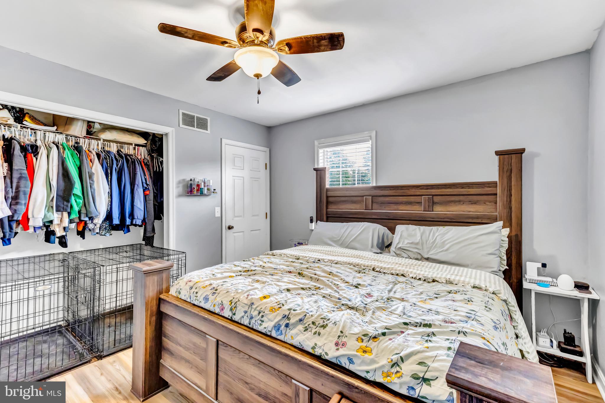 4925 Campground Road Eden, MD 21822 - Photo 17 of 42 a bedroom with a bed and a chandelier