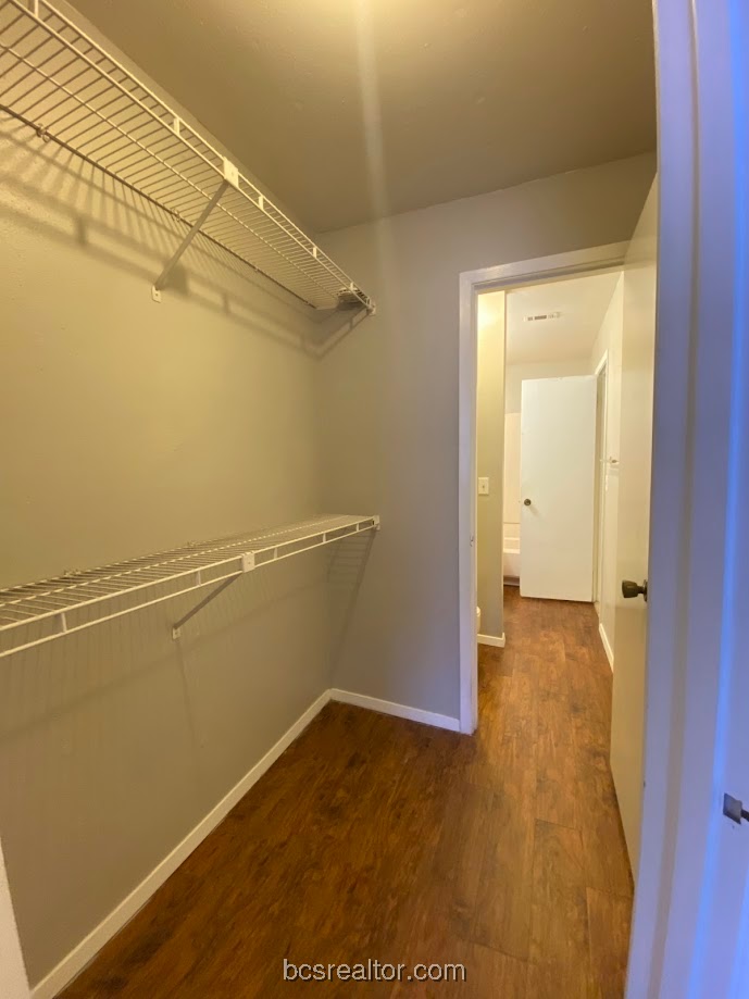 1305 West Villa Maria Road, Unit B106 Bryan, TX 77801 - Photo 12 of 14 a view of a room with wooden floor