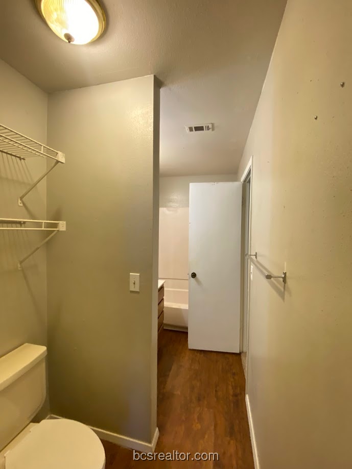 1305 West Villa Maria Road, Unit B106 Bryan, TX 77801 - Photo 13 of 14 a bathroom with a toilet