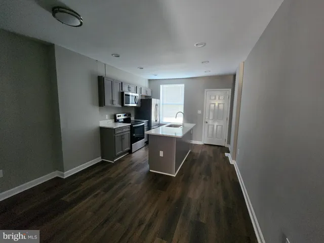 a view of a kitchen from the hallway