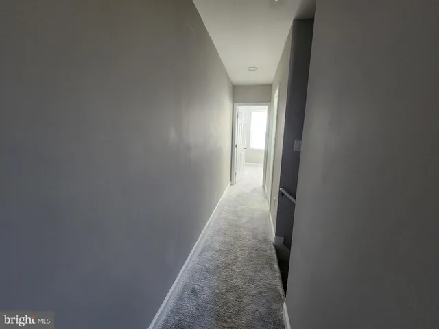 a view of a hallway with a window