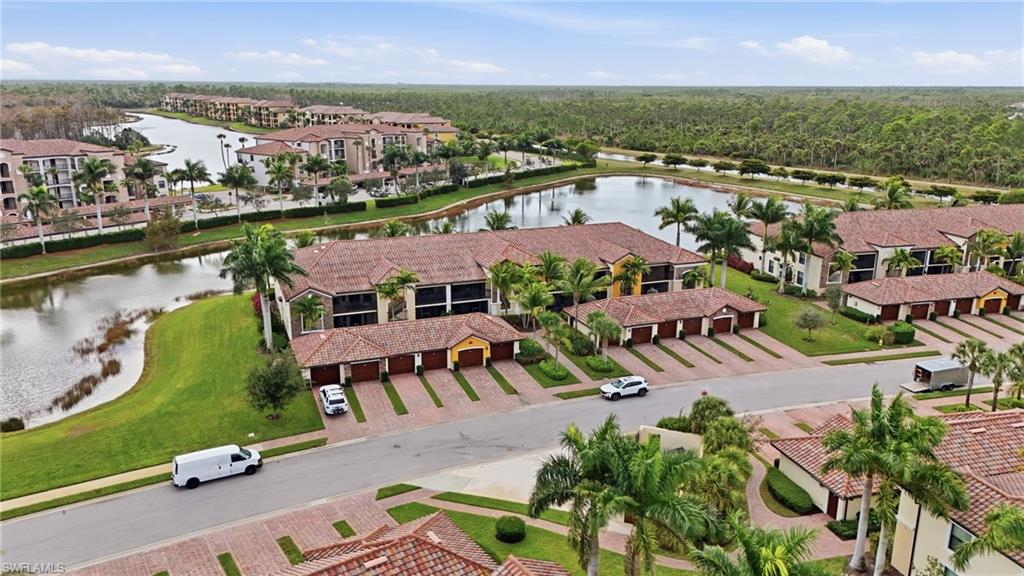 9528 Avellino Way, Unit 2521 Naples, FL 34113 - Photo 2 of 41 an aerial view of residential houses with outdoor space and river view