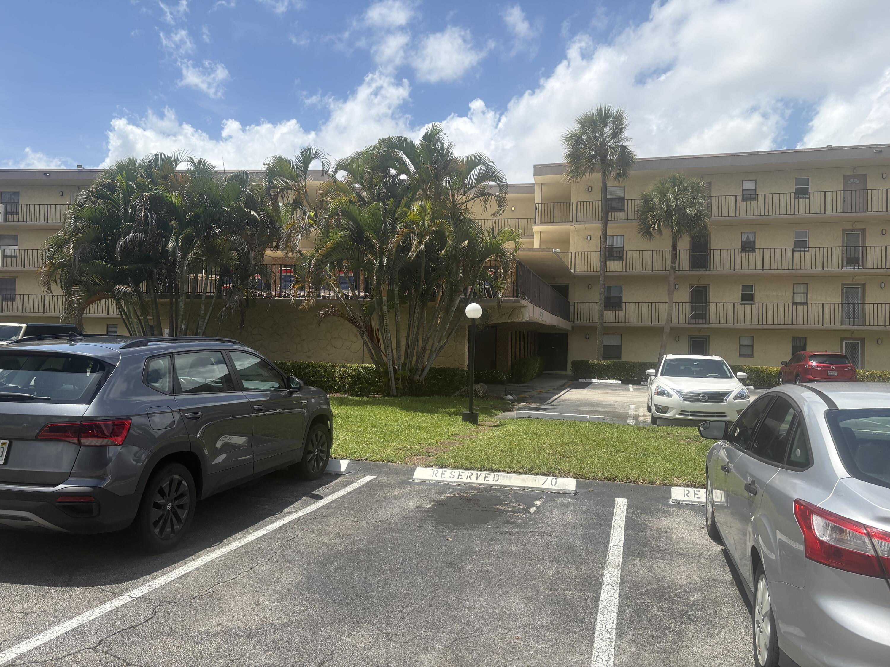 9355 Southwest 8th Street, Unit 225 Boca Raton, FL 33428 - Photo 1 of 21 a view of a street with cars