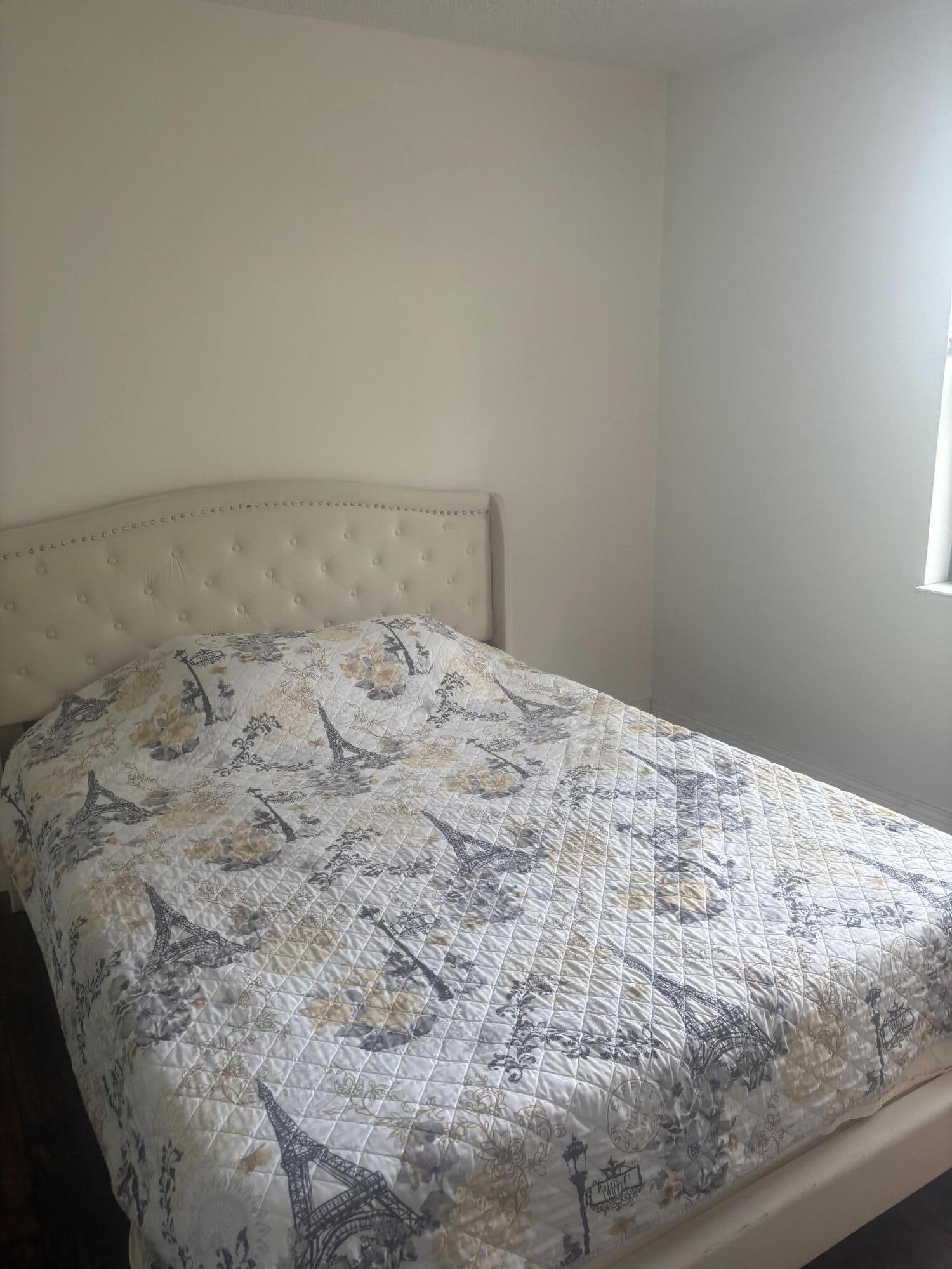9355 Southwest 8th Street, Unit 225 Boca Raton, FL 33428 - Photo 14 of 21 a bedroom with a bed