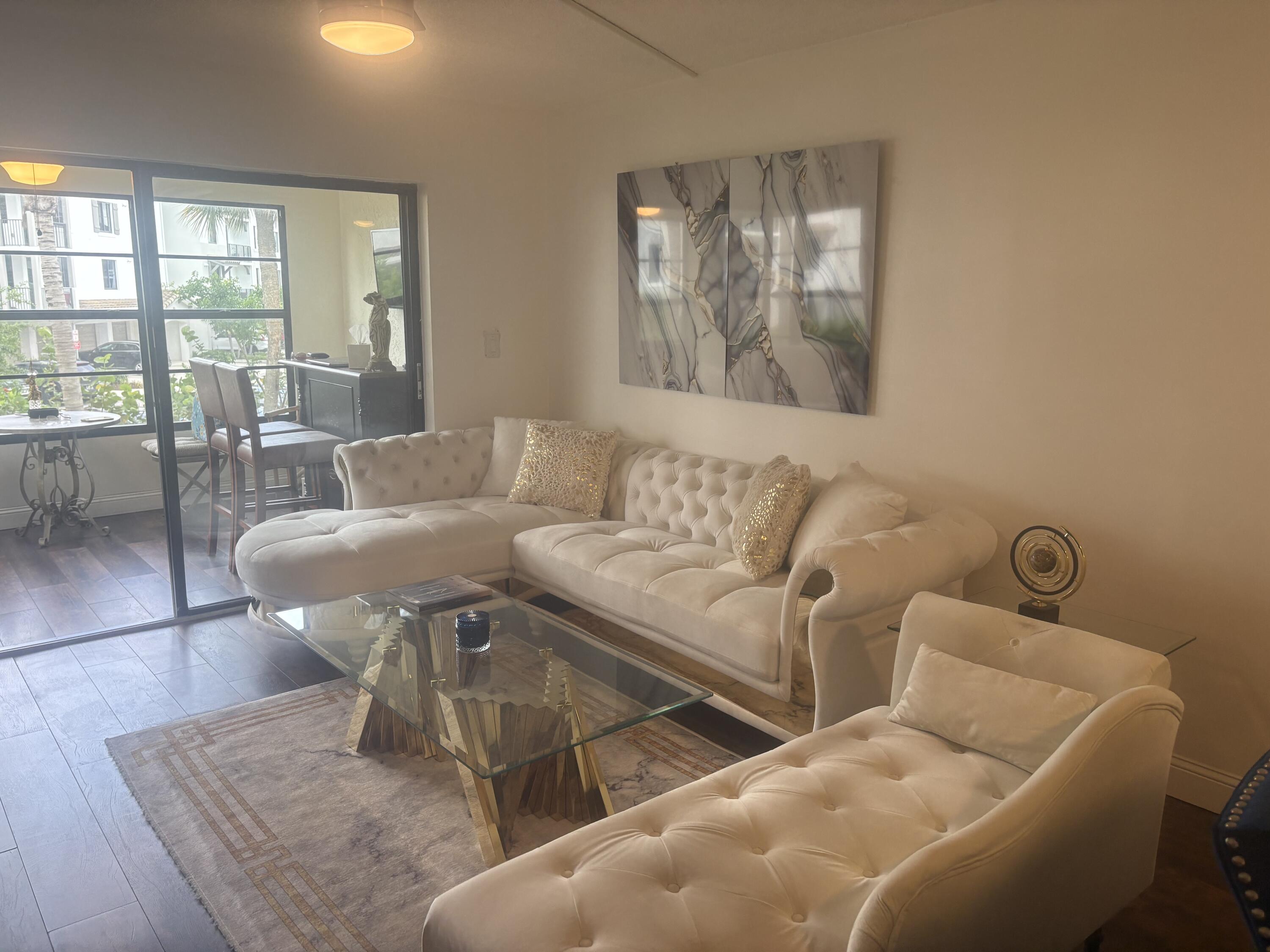 9355 Southwest 8th Street, Unit 225 Boca Raton, FL 33428 - Photo 2 of 21 a living room with furniture and a window