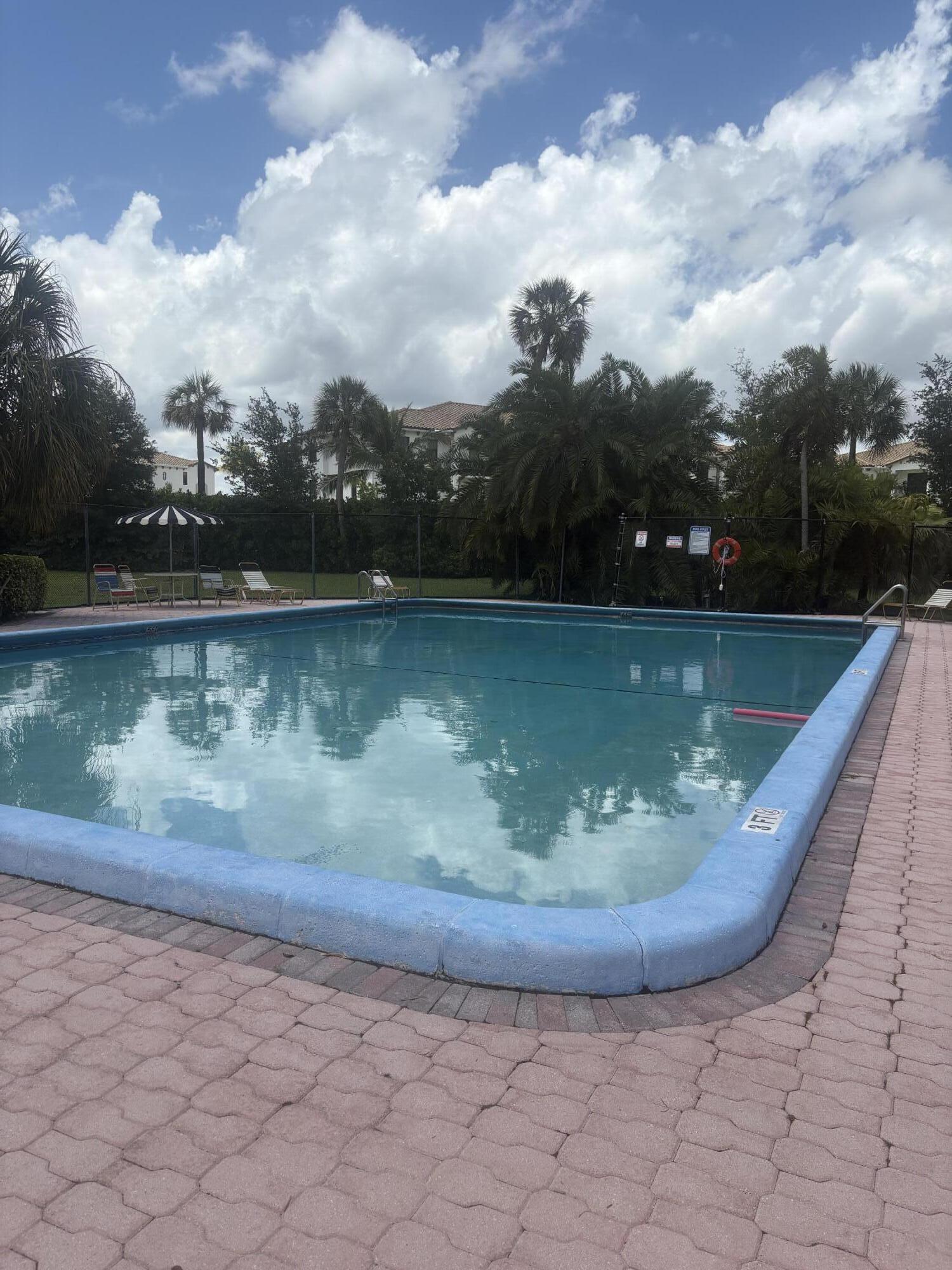 9355 Southwest 8th Street, Unit 225 Boca Raton, FL 33428 - Photo 21 of 21 a view of a swimming pool from a lake