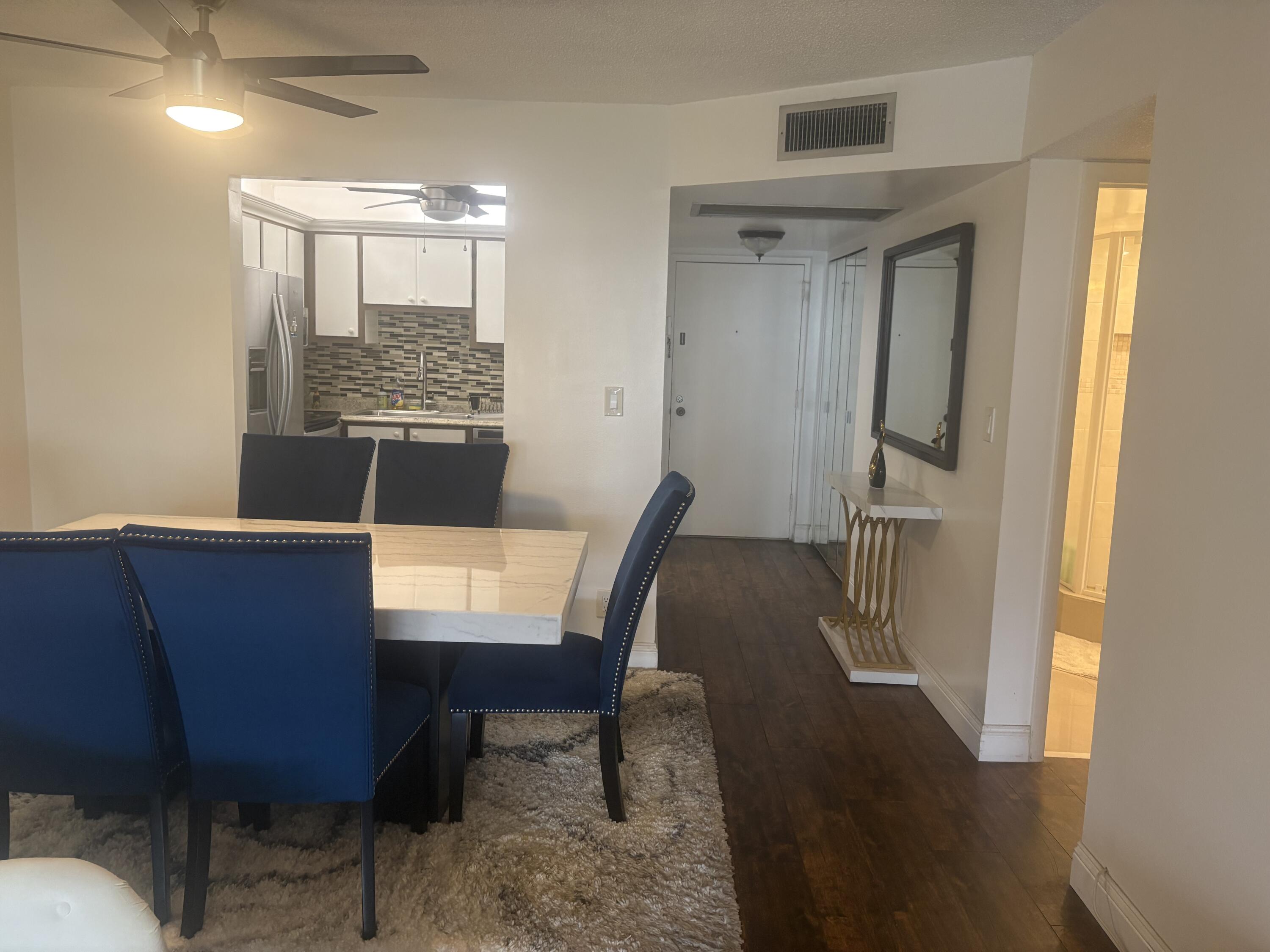 9355 Southwest 8th Street, Unit 225 Boca Raton, FL 33428 - Photo 10 of 21 a view of a dining room with furniture and a window
