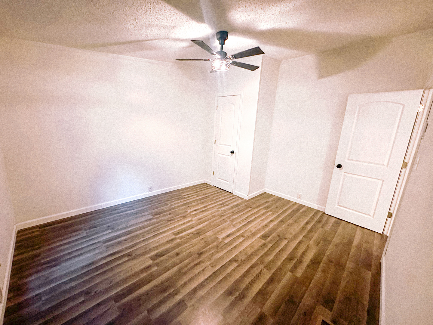 4920 Mt Moriah Road Galatia, IL 62935 - Photo 19 of 33 a view of a room with wooden floor and a ceiling fan