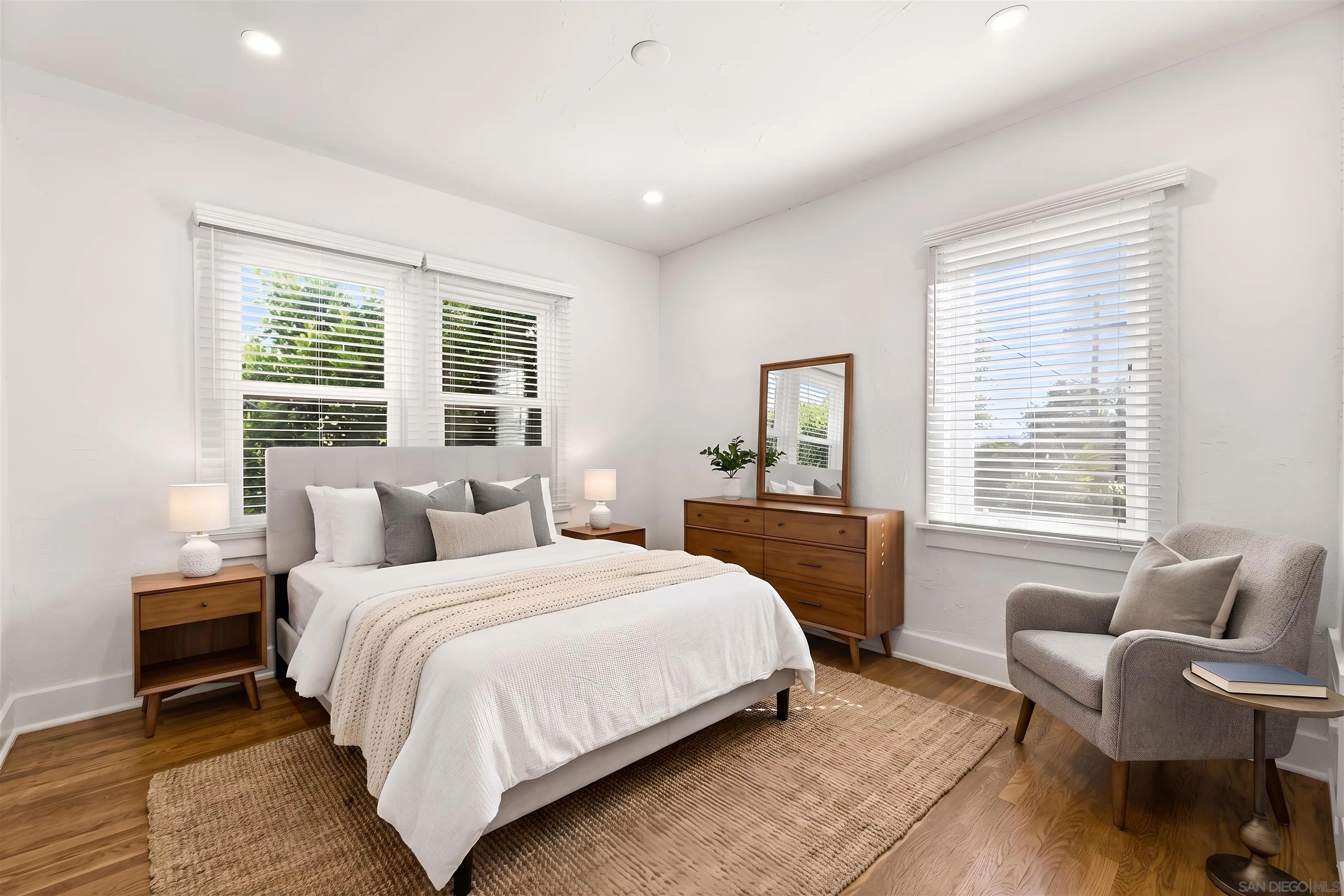 915 North Kenneth Road Burbank, CA 91501 - Photo 5 of 7 a bedroom with a bed and wooden floor