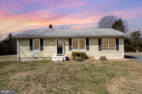 a front view of a house with yard
