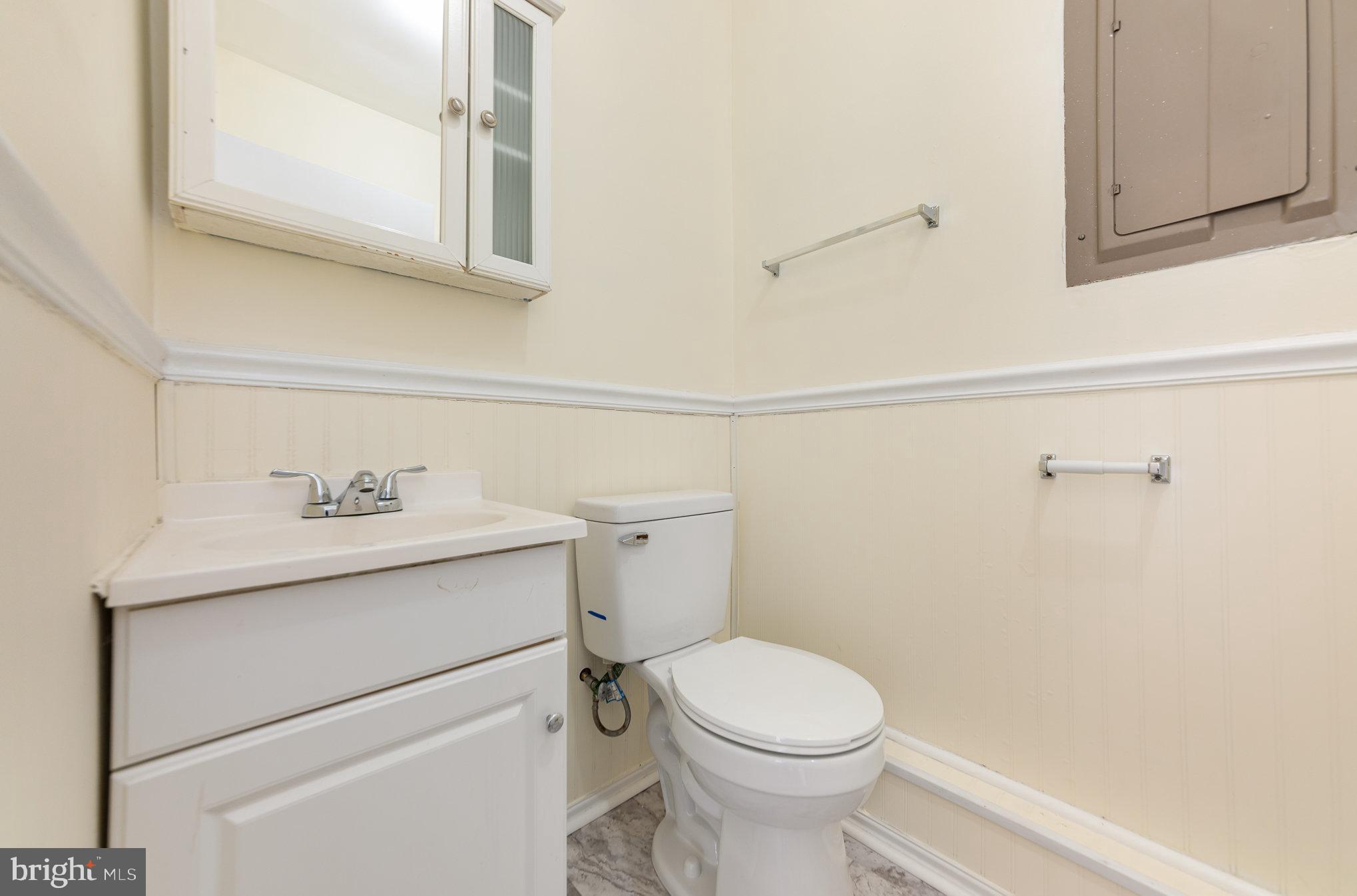 8430 Courthouse Road Spotsylvania, VA 22551 - Photo 17 of 23 a bathroom with a sink a toilet and vanity