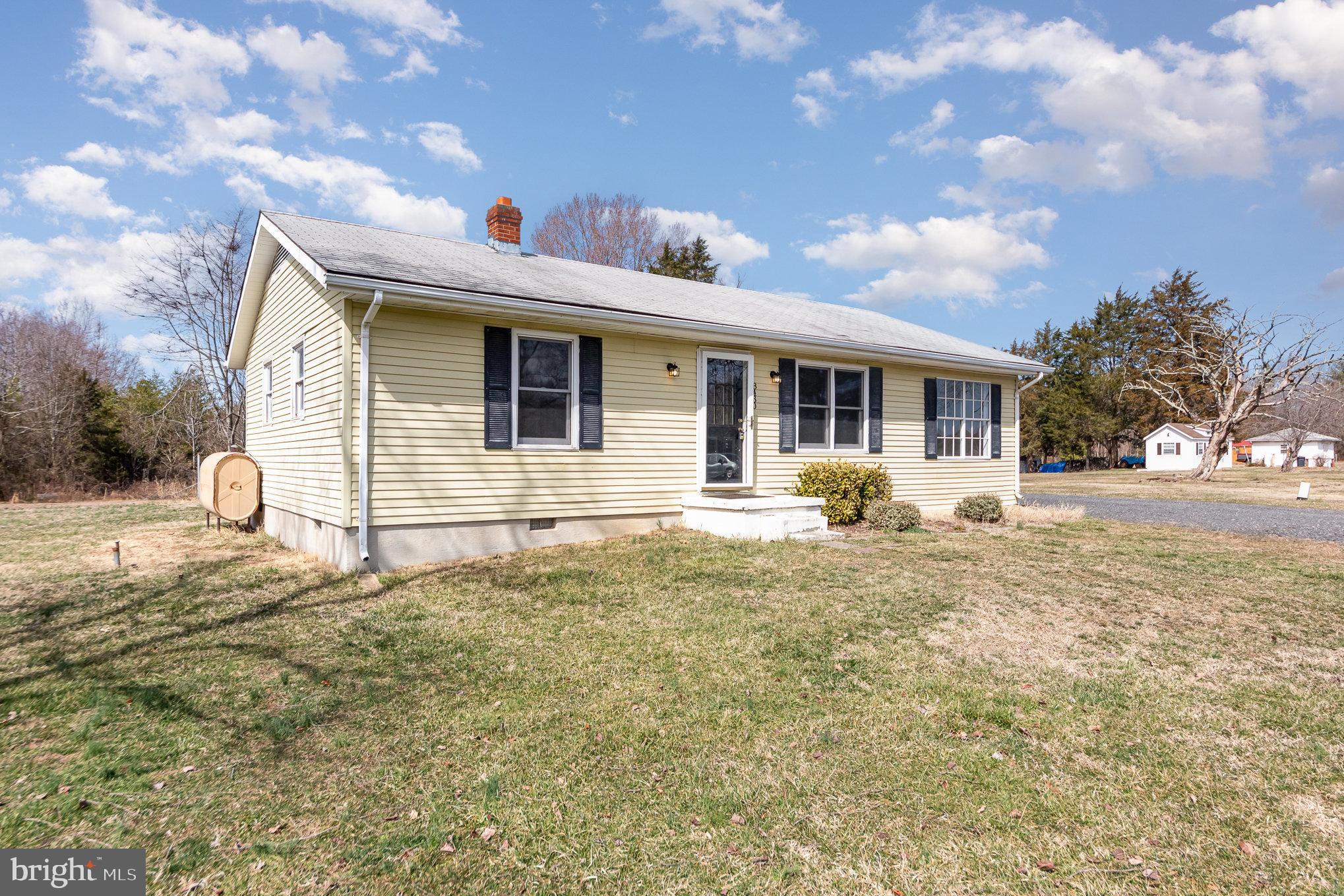 8430 Courthouse Road Spotsylvania, VA 22551 - Photo 3 of 23 a front view of a house with a yard