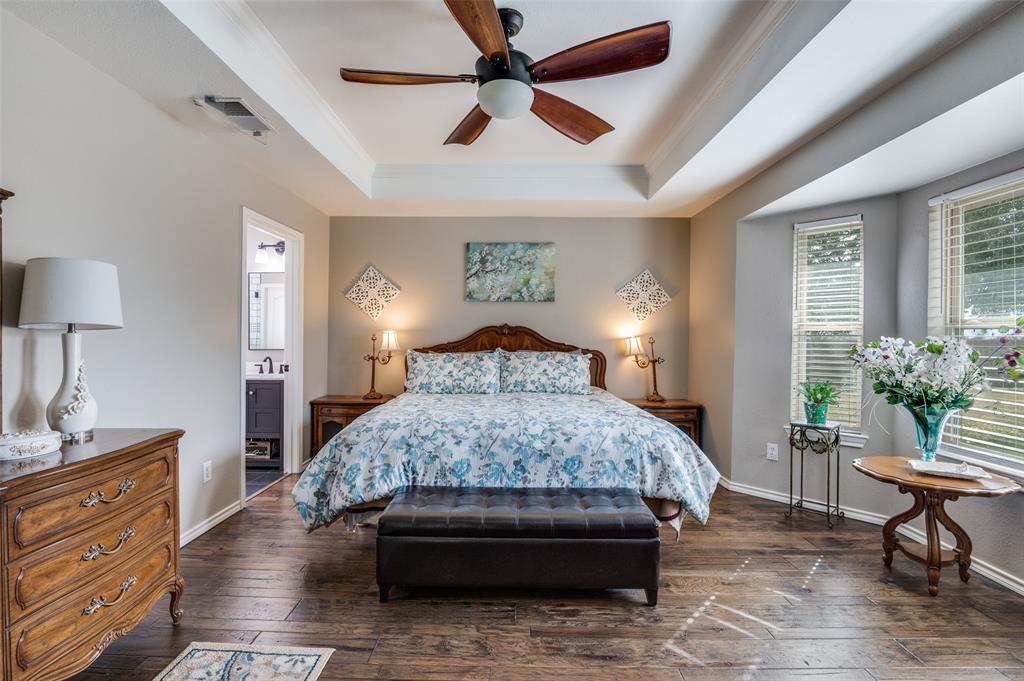 140 Hollis Road Waxahachie, TX 75167 - Photo 16 of 40 a bedroom with a bed and a table