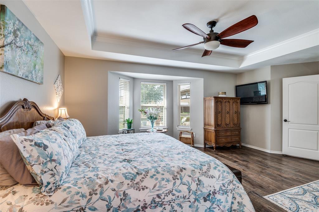 140 Hollis Road Waxahachie, TX 75167 - Photo 17 of 40 a bedroom with a bed dresser and a large window