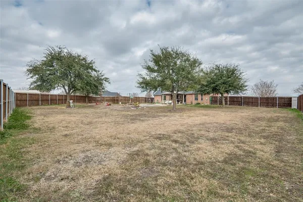 a view of outdoor space with deck and yard
