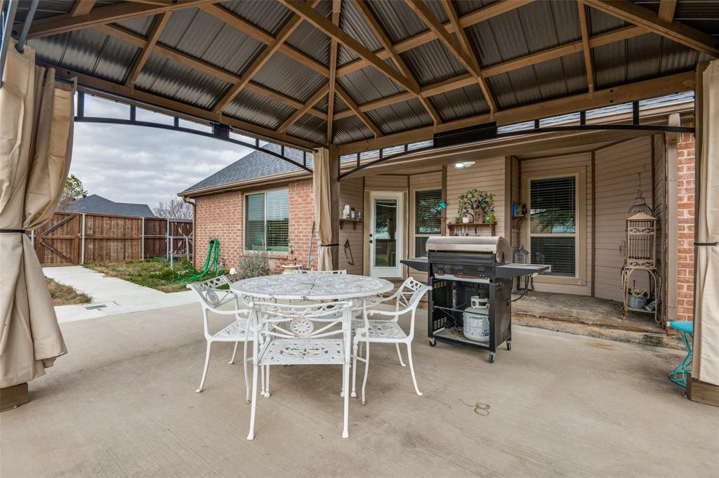 140 Hollis Road Waxahachie, TX 75167 - Photo 26 of 40 a view of a dinning table and chairs in the room