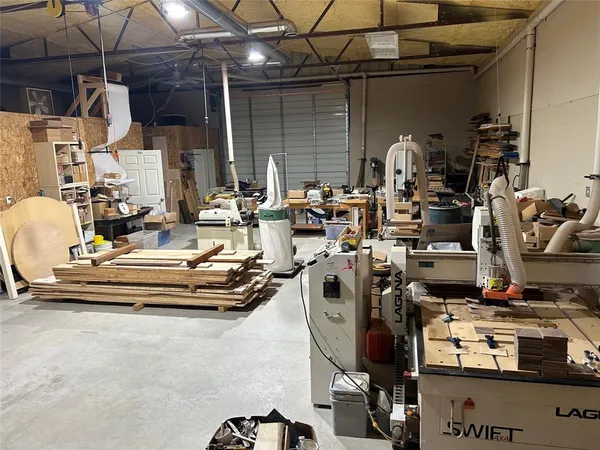 a view of a patio with table and chairs